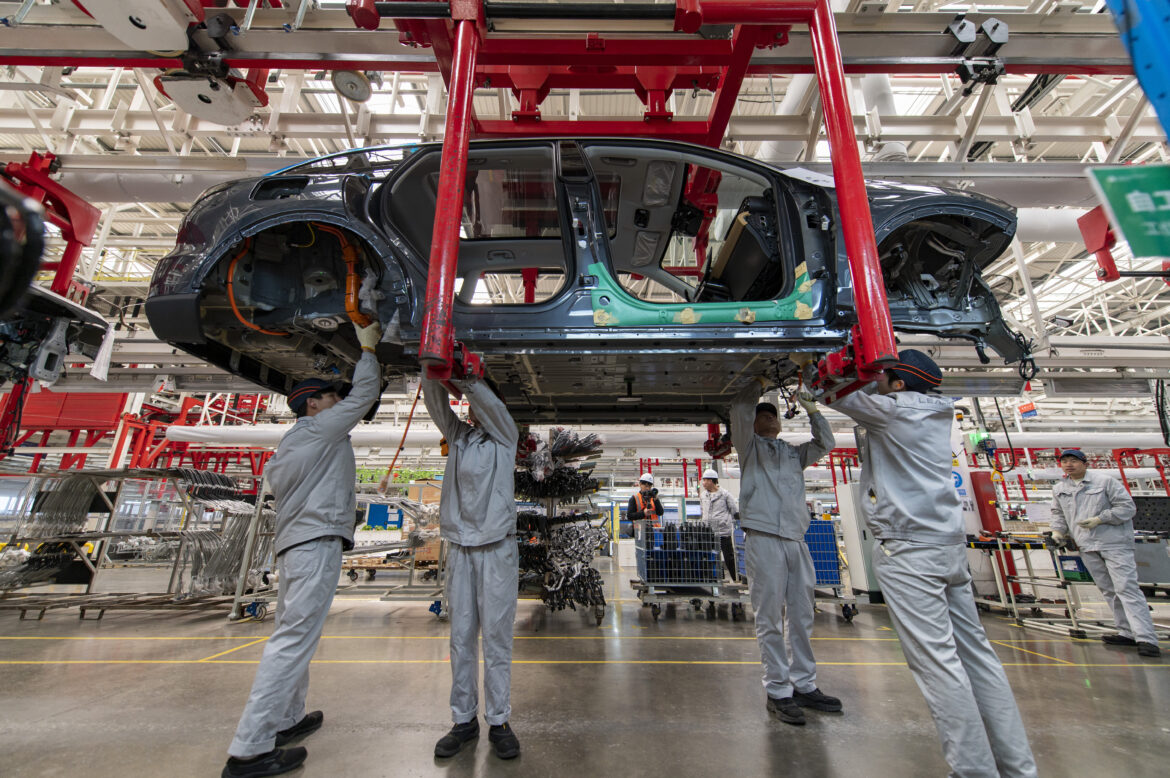 NEV Factory Employs Robotic Arms To Improve Efficiency In Jinhua